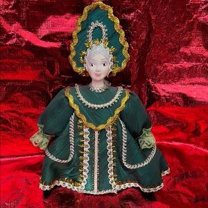 Elegant Green and Gold Decorative Doll